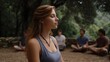 © Thares2020 - Young woman meditating outdoors with a group in a serene natural setting