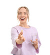 © Pixel-Shot - Young woman with soluble tablet and glass of water on white background
