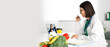 © Pixel-Shot - Female nutritionist video chatting with patient at table in office
