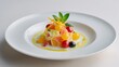 © fivan - Carefully scooped quenelle of fruit pasta salad plated individually with mint sprig and citrus zest, minimalist white fine-dining plate, refined presentation