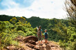 © kieferpix - Mother and son hiking mountain trail together with backpacks exploring nature
