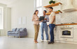 © Studio Romantic - Young married couple discussing contract with female realtor agent looking through the documents standing in kitchen of new house. Family ready to become homeowners. Real estate market concept.