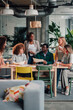 © Zamrznuti tonovi - Diverse business team collaborating in comfortable office space