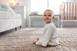 © New Africa - Cute baby on floor at home. Space for text