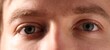 © New Africa - Macro view of young man with beautiful eyes