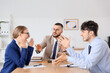 © Pixel-Shot - Business mediator working with angry clients at table in office