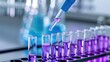 © savittree - Lab Equipment with Test Tubes and Pipette in Science Experiment Displaying Purple Liquid for Research or Experimentation