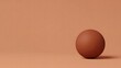 © hafizJibran - Spherical Terracotta Object on Monochromatic Background