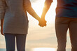 © peopleimages.com - Couple, love and holding hands for travel outdoor with sunshine, adventure and bonding together. Back, people and sightseeing with nature view, romantic getaway and partner affection on vacation trip