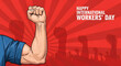 © RezoanKhan - A muscular arm flexing in celebration of International Workers' Day with a red background