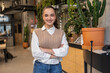 © BusinessClass by W61 - Confident entrepreneur smiling in modern coworking office indoor
