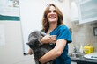 © Gonzalo Infiesta - Professional female veterinarian holding a domestic cat in clinic