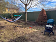 © phpetrunina14 - Father relaxing in hammock in backyard with stroller