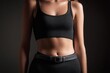 © zenith - Close-up of woman wearing black tank top and belted pants in studio