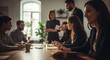© Benjamin - A group of diverse business professionals engaged in a meeting around a wooden conference table in a modern office.