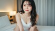 © AiPhoto - ベッドの上で四つん這いになり視線を外すキャミソール姿の女性