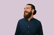 © Vulp - Bearded Man Looking To Side, Smiling With Thoughtful Optimism, Studio Portrait Conveying Startup Spirit