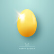 © barmaleeva - Yellow egg with light flare on turquoise background with Happy Easter text. Concept of Easter greeting card and holiday poster