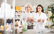© JackF - Elderly woman chooses pills for headache and allergy and consults with a pharmacist about the choice of medicines in a European pharmacy. Woman buys high-quality European medicines