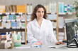© JackF - Adult female pharmacist working with computer in pharmacy