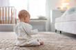© New Africa - Cute baby on floor at home. Space for text