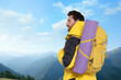 © New Africa - Man with backpack enjoying mountain view. Active lifestyle