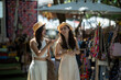 © apichat - Women shopping at summer outdoor market