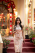 © apichat - Asian woman celebrating chinese new year wearing traditional qipao