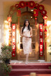 © apichat - Asian woman celebrating chinese new year in qipao