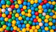 © adhotds23 - Colorful plastic balls filling a ball pit viewed from directly above in a vibrant and playful environment