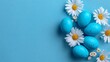 © Mitchell - A vibrant Easter-themed arrangement of blue eggs and white daisies on a light blue background