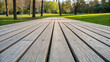 © MOSAMMAT FARIDA - Parallel wooden planks arranged in a spacious outdoor seating area