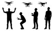© Yasith - Dynamic silhouettes of men interacting with drones, showcasing modern remote control technology and aerial observation