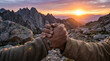 © Rohan Katwe - Two hikers shake hands on a rocky mountain ridge at sunset, symbolizing teamwork, trust and accomplishment after an adventurous hike in the wilderness surrounded by dramatic landscape light.