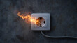 © Jane_S - Wall outlet sparking and burning with flame on concrete surface