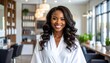 © ruangrit19 - Beautiful african american woman in a salon smiling with professionally styled long hair perfect for lifestyle and beauty content.