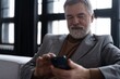 © opolja - Mature smiling man using smartphone