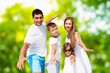 © BillionPhotos.com - A happy family walks in park at vacation time