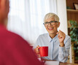 © Lumos sp - Portrait of an active senior elderly businesswoman during a meeting in the office