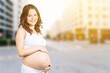 © BillionPhotos.com - Portrait of a happy pregnant woman hold belly