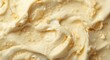 © AkuAku - creamy vanilla gelato texture enriched with yellow and white swirling patterns for dessert background