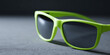 © perfectlab - Green sunglasses with dark lenses close-up