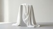 © Sullindya - Elegant White Fabric Draped Over Pedestal for Ramadan MockUp Display with Soft Lighting