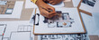 © InfiniteFlow - A designer workspace showcasing detailed sketches and colorful notes surrounding a clipboard, highlighting the creative process of architectural planning and design. SACTR