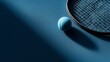 © liliyabatyrova - A vibrant blue tennis court showcases a sleek racket alongside a bright blue ball. Sunlight casts shadows, creating a dramatic setting perfect for practice or playful competition
