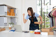 © Fahng - Online Selling Business Successful Asian Woman and man Smiling, Glad, Working From Home With Parcel Box And Laptop Online Order With Delivery SmE Business Ideas