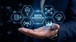 © Pro Stock Hub - Business professional holding glowing data warehouse technology network with ETL, SQL, and cloud storage icons in a digital abstract background.