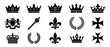 © stocker777 - Set of black royal heraldic symbols including various crowns, a scepter, fleur-de-lis, laurel wreaths, iron crosses, and a lion coat of arms in a minimalist graphic icon collection