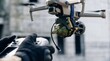 © Mary - Military drone modified with an explosive device, flying overhead, controlled by a soldier's hands.