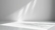 © Muhammad - Bright sunlight streaming through empty room with white walls